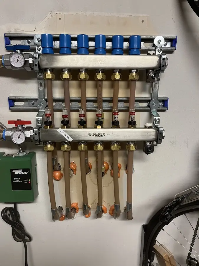 Plumber performing Water Heater Repair at a residential property in Woodbury